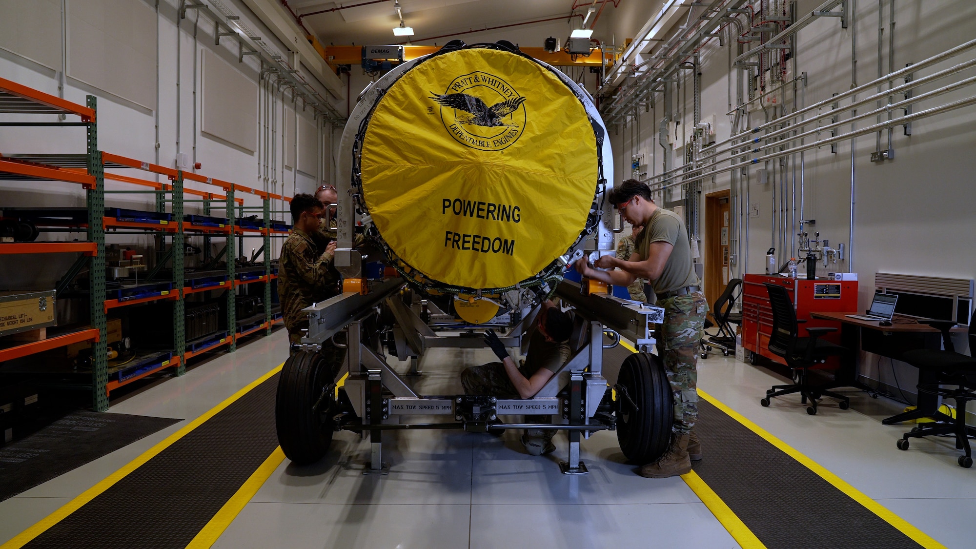 airmen work on a F-135 engine