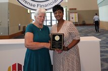 Photo of a woman receiving an award.