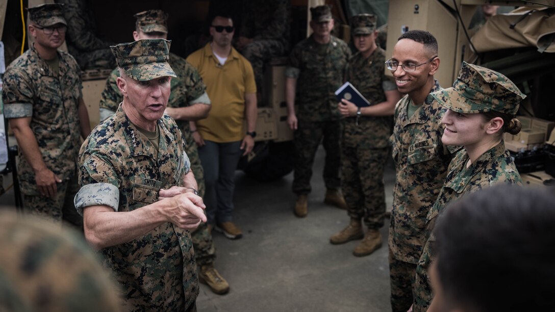 U.S. Marine Corps Gen. Eric M. Smith, left, the 39th Commandant of the Marine Corps, engages with Marines from 1st Battalion, 2d Marine Regiment, 2d Marine Division on Camp Lejeune, North Carolina, June 10, 2024. During his visit, Smith engaged with Marines from across 2d Marine Regiment and Camp Lejeune to discuss force design, quality of life as well as recognize some top-performing Marines. (U.S. Marine Corps photo by Cpl. Noelia Vazquez)