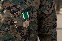 U.S. Marines with 2nd Battalion, 23rd Marine Regiment, 4th Marine Division, are awarded the Navy Marine Corps Commendation Medal by Col. Steven J. White, the commanding officer of 23rd Marine Regiment, for earning the Super Squad Competition medal during a division-wide squad competition, Pico Rivera, California. Dec. 9, 2017.  The Super Squad Competition is designed to evaluate a 14-man infantry squad throughout an extensive field and live-fire evolution. (U.S. Marine Corps photo by Lance Cpl. Ricardo Davila/Released)