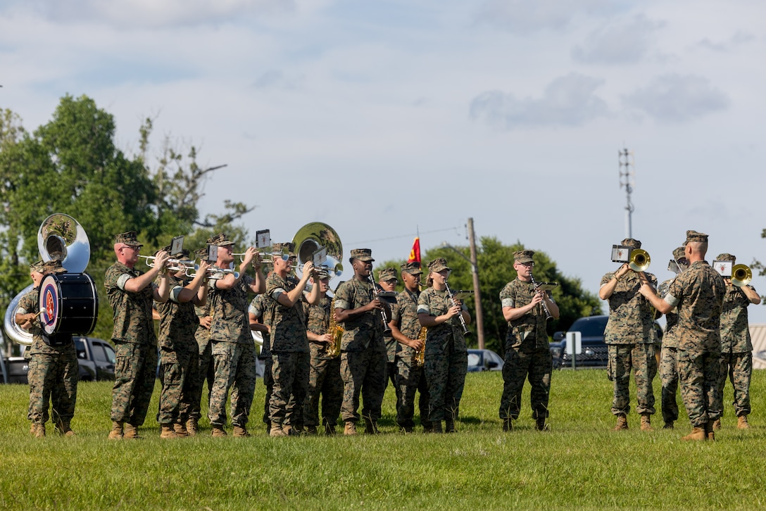 U.S. Marines with the 2d Marine Division (MARDIV) Band perform during a change of command ceremony on Camp Lejeune, North Carolina, June 13, 2024. During the ceremony, U.S. Marine Corps Col. Gregory P. Gordon, the outgoing commanding officer of 6th Marine Regiment, 2d MARDIV, relinquished command to Col. Neil R. Berry. (U.S. Marine Corps photo by Lance Cpl. Grace Stover)