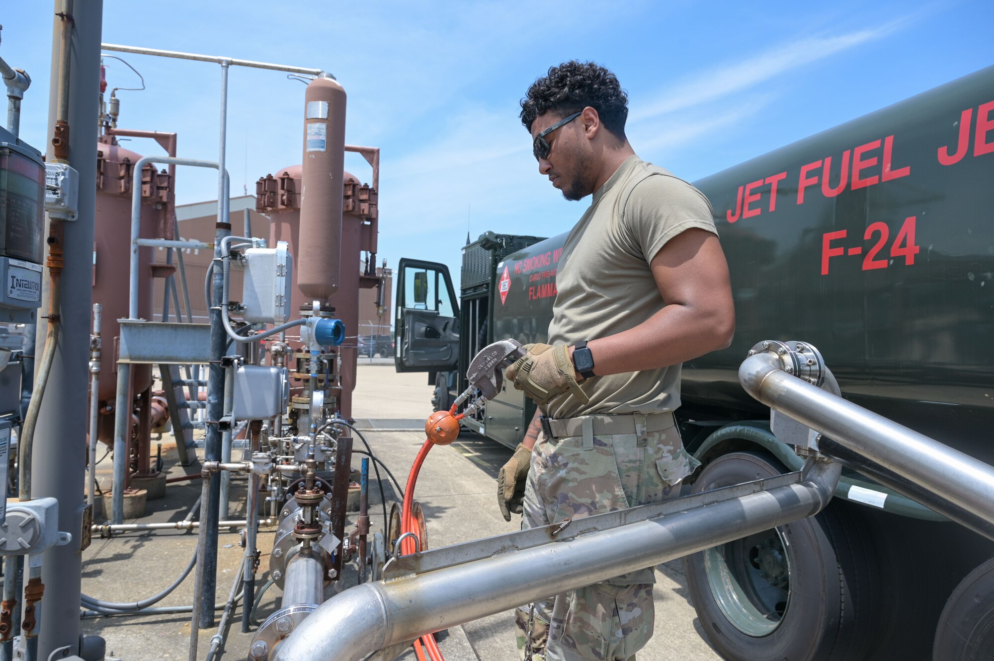 Airman pumps fuel into fuel truck.