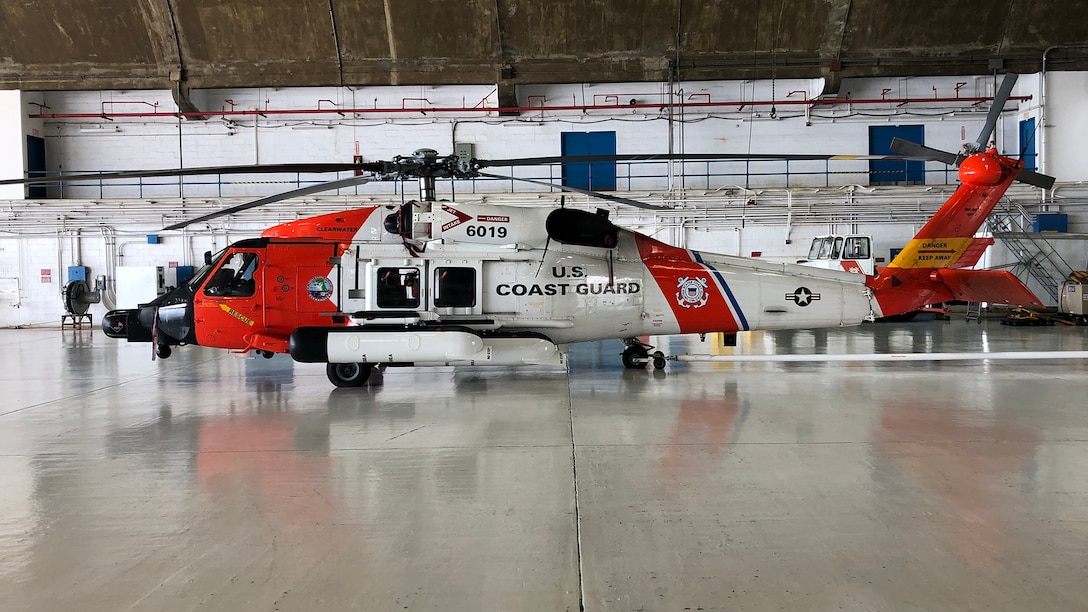 A Coast Guard Air Station Clearwater MH-60 Jayhawk helicopter deployed to Coast Guard Air Station Borinquen, Puerto Rico sits on the deck of the hanger Thursday, Aug. 29, 2019 standing by to assist in any search and rescue or post-storm missions.