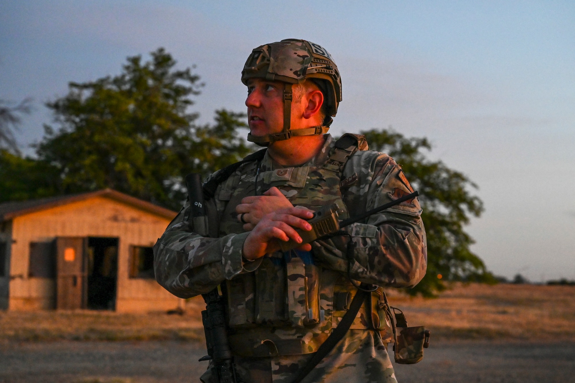 U.S. Air Force Tech. Sgt. Zachary Boone, 9th Security Forces Squadron flight chief, communicates with the observation tower via radio during Exercise READY DRAGON at Beale Air Force Base, California, June 3, 2024.