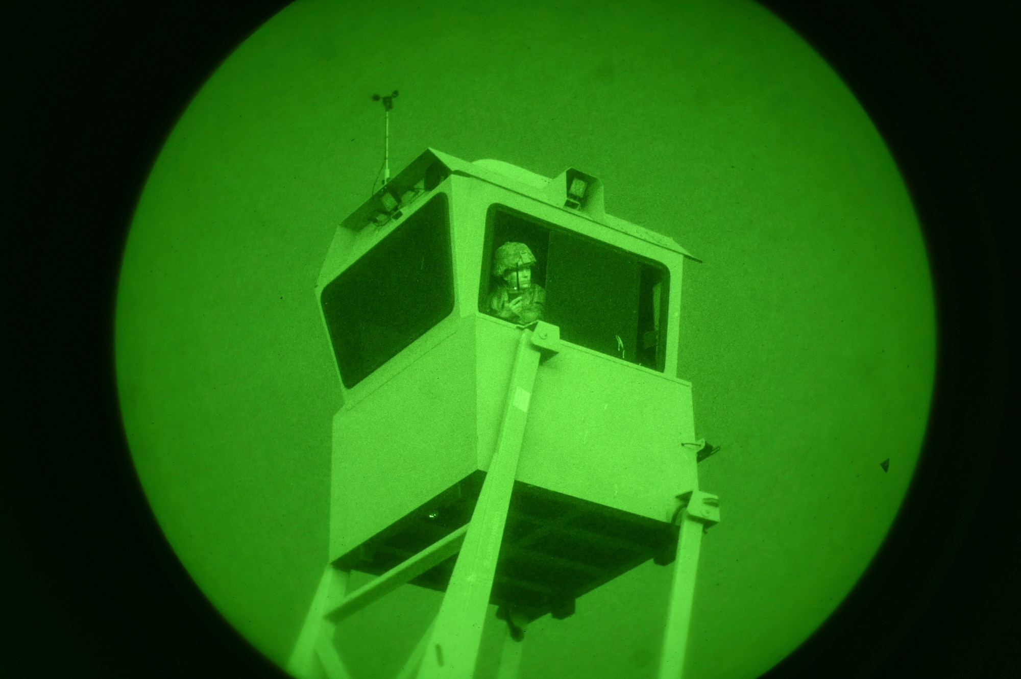 U.S. Air Force Airman 1st Class Kathryn Anderson, 9th Aircraft Maintenance Squadron crew chief, holds position in the sky watch tower while communicating with Security Forces on the ground via radio, during Exercise READY DRAGON at Beale Air Force Base, California, June 3, 2024.