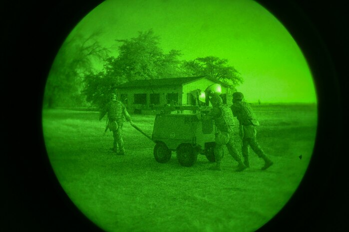 Airmen from the 9th Reconnaissance Wing set up lights for the night shift during Exercise READY DRAGON at Beale Air Force Base, California, June 3, 2024.