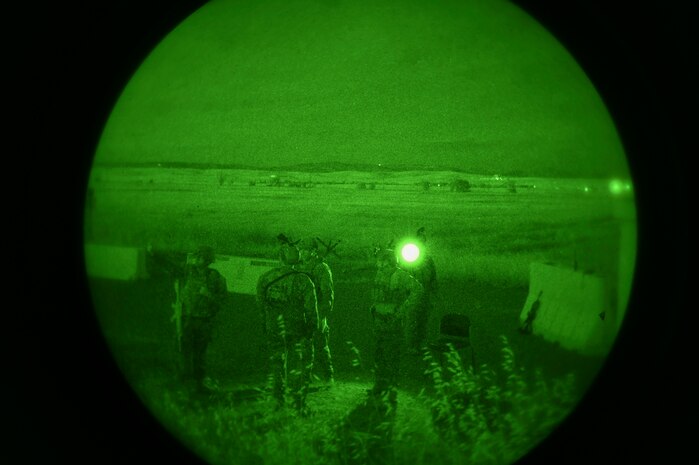 Airmen from the 9th Security Forces Squadron guard an entry control point during Exercise READY DRAGON at Beale Air Force Base, California, June 4, 2024.