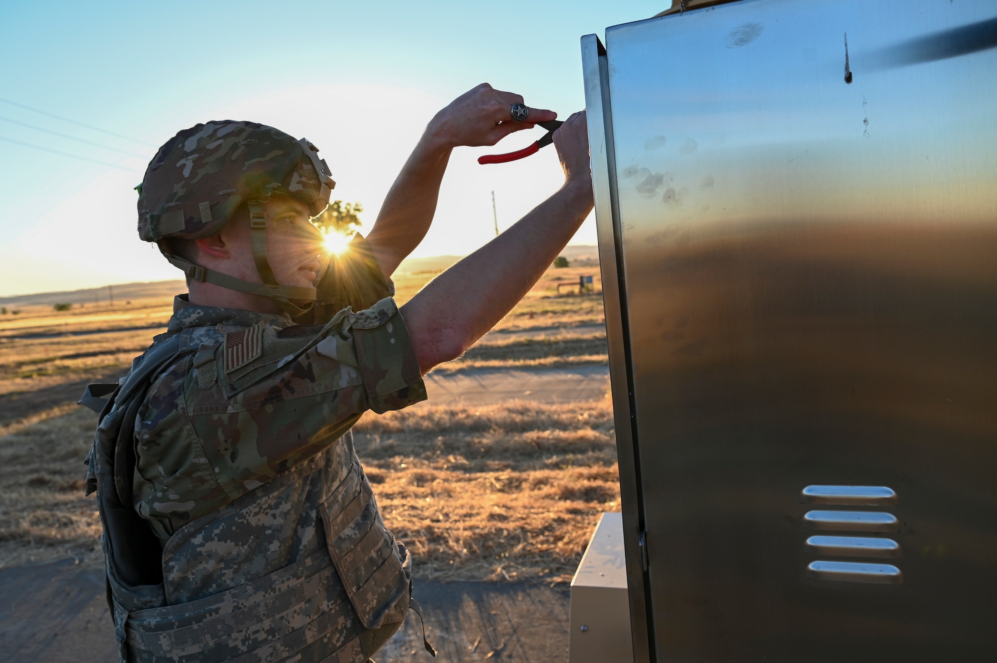 U.S. Air Force Senior Airman Joshua Cox, 9th Communications Squadron radio technician, inspects the giant voice during Exercise READY DRAGON at Beale Air Force Base, California, June 4, 2024.
