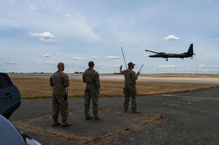 U.S. Air Force Master Sgt. Cameron Pointek, 9th Operations Support Squadron landing zone controller, U.S. Air Force Tech. Sgt. David Rost, 9th Operations Support Squadron landing zone controller, and U.S. Air Force Senior Master Sgt. Nathan Van Dyne, 9th Reconnaissance Wing Inspector General superintendent inspector general, cleared a U-2 Dragon Lady for take off from Beale Air Force Base, California, during EXERCISE READY DRAGON June 3, 2024.