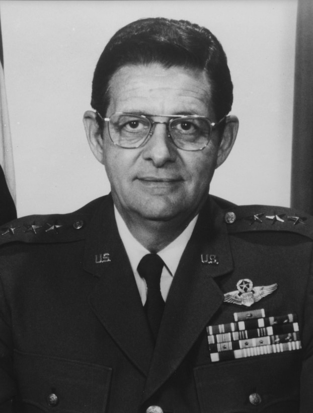 Black and white photo of a white man in dress uniform with ribbons on chest