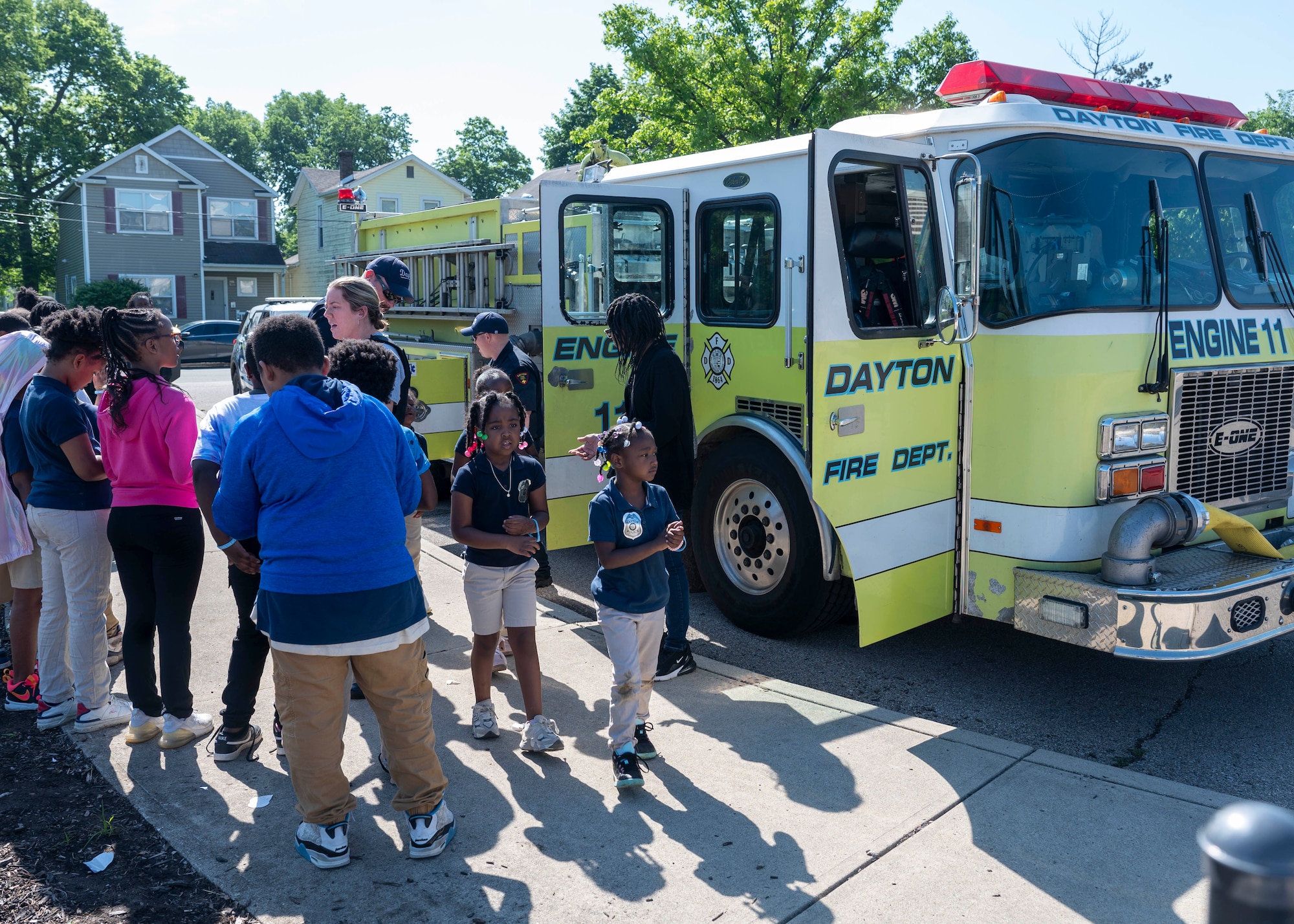 Members of the Dayton fire Department talked to the children at Edison Elementary School about fire safety during an end of the school year field day in Dayton, Ohio, May 16, 2024. Members of AFLCMC volunteer yearly with the local school to help with this large event. (U.S. Air Force photo by Staff Sgt. Mikaley Kline)