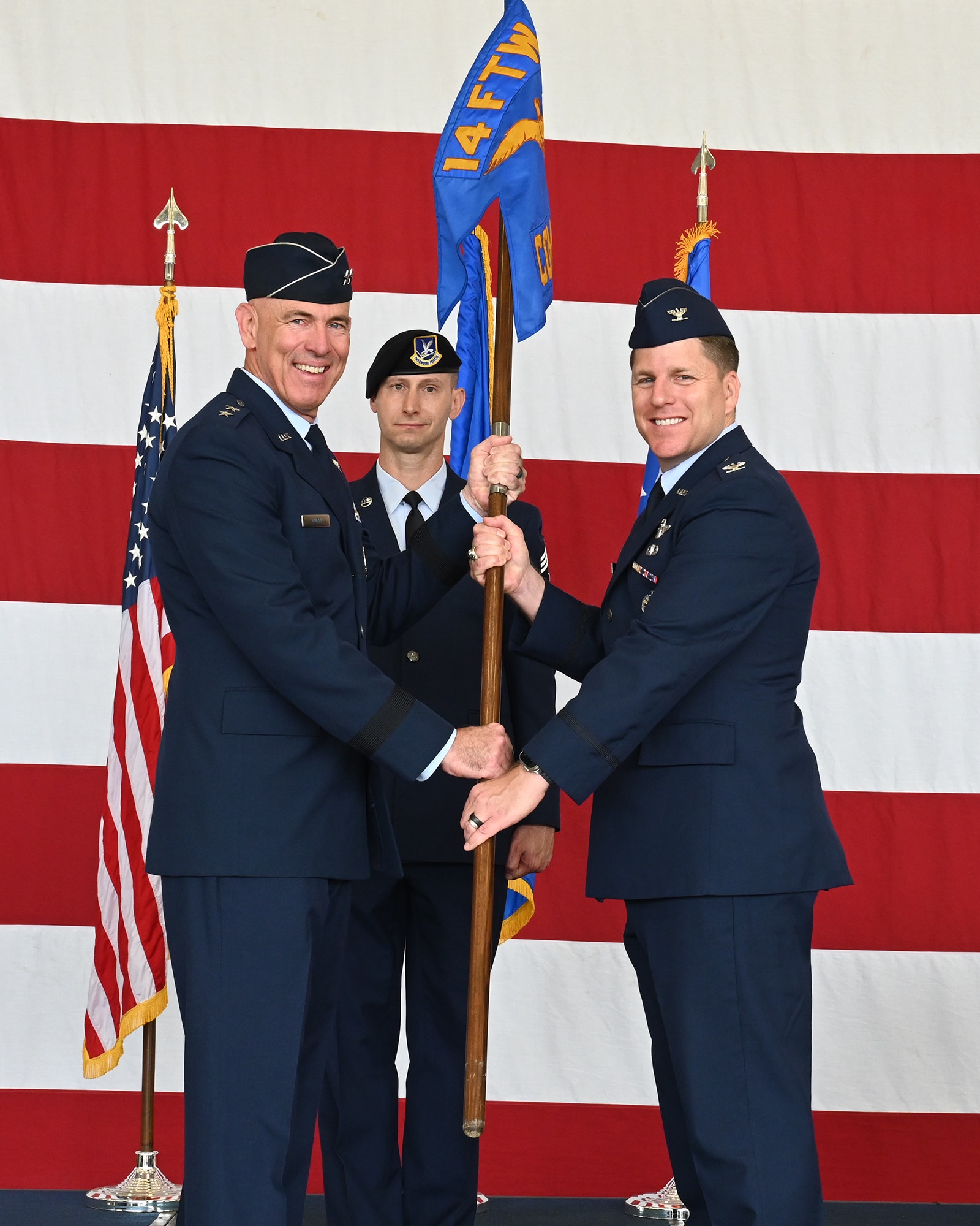 Maj. Gen. Quinn passing the guidon to Col. Blech.