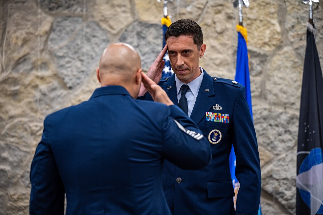Lt Col Wilkinson returns a salute to Chief Master Sgt Storman