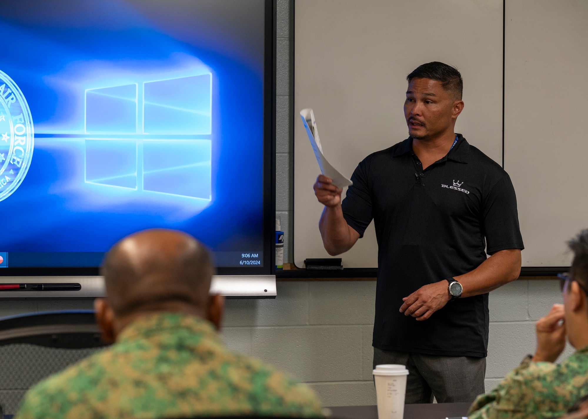 Photo of a person briefing a class