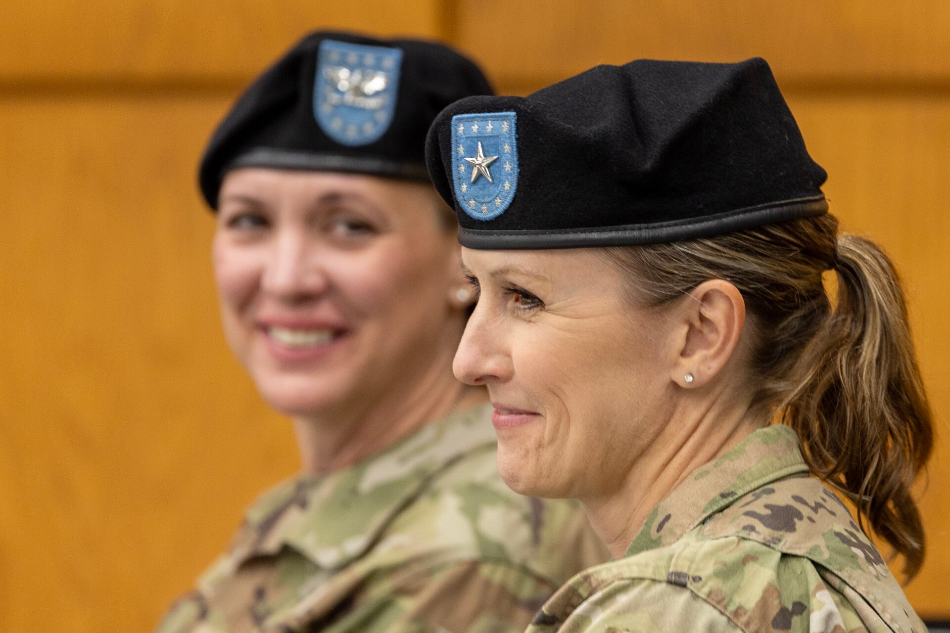 Brig. Gen. Paige M. Jennings, outgoing U.S. Army Financial Management Command commanding general, smiles as Col. Michelle M. Williams, incoming USAFMCOM commander, looks on during a USAFMCOM change of command ceremony at the Maj. Gen. Emmett J. Bean Federal Center in Indianapolis June 18, 2024. USAFMCOM delivers precision enterprise-wide financial operations to integrate, synchronize and sustain the battlefield through the Joint Strategic Support Area and directly supports the Office of the Assistant Secretary of the Army for Financial Management and Comptroller in their role as the principal advisor on all matters related to financial management and comptrollership. (U.S. Army photo by Mark R. W. Orders-Woempner)