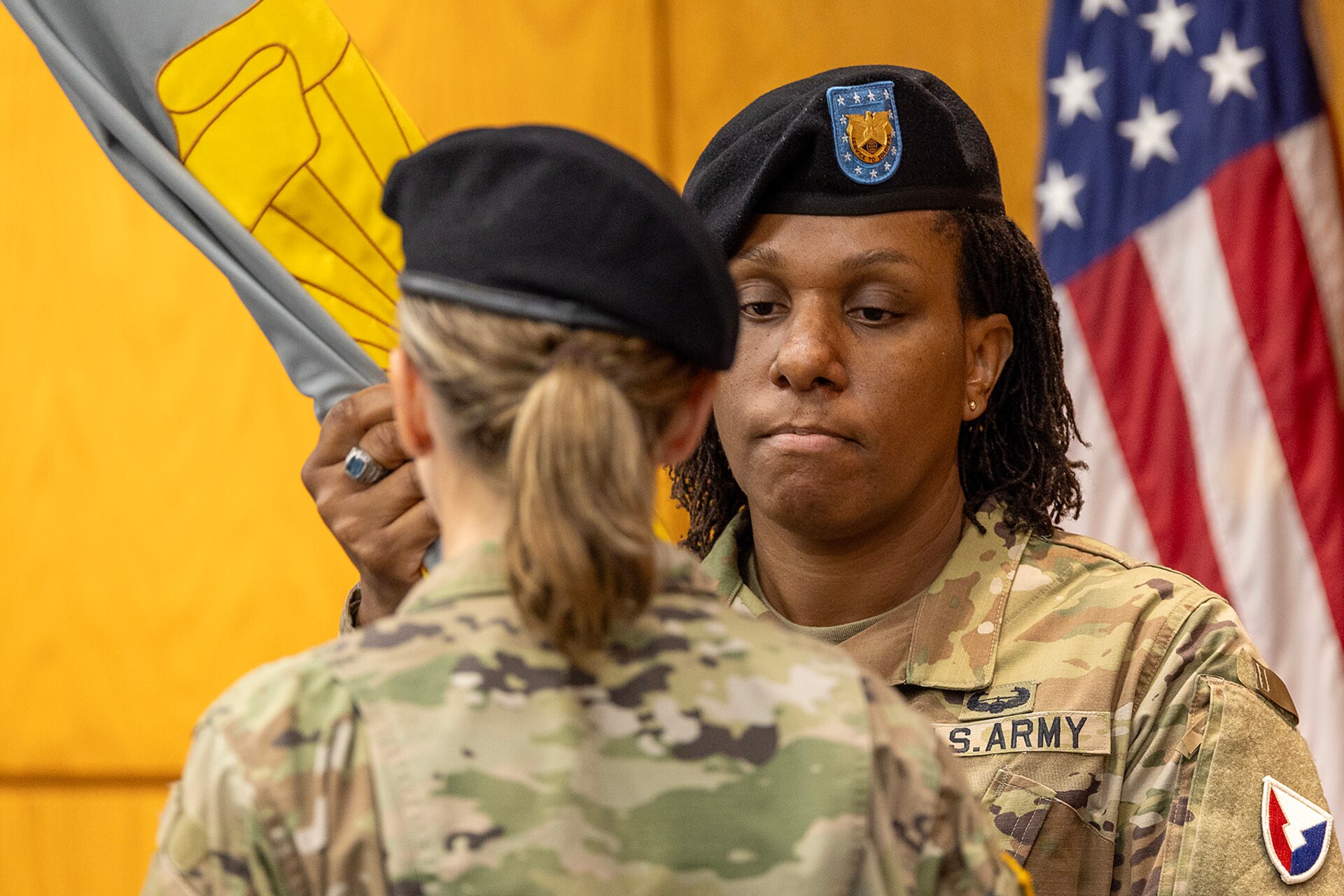 Command Sgt. Maj. Joy L. Allen, U.S. Army Financial Management Command senior enlisted advisor, hands the USAFMCOM colors to Brig. Gen. Paige M. Jennings, outgoing USAFMCOM commanding general, during a change of command ceremony at the Maj. Gen. Emmett J. Bean Federal Center in Indianapolis June 18, 2024. USAFMCOM delivers precision enterprise-wide financial operations to integrate, synchronize and sustain the battlefield through the Joint Strategic Support Area and directly supports the Office of the Assistant Secretary of the Army for Financial Management and Comptroller in their role as the principal advisor on all matters related to financial management and comptrollership. (U.S. Army photo by Mark R. W. Orders-Woempner)