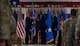 U.S. Air Force Col. Kenneth McGhee, outgoing 91st Missile Wing (MW) commander, gives the guidon to U.S. Air Force Maj. Gen. Stacy Huser, 20th Air Force commander, during the 91st MW change of command ceremony at Minot Air Force Base, North Dakota, June 18, 2024. McGhee gave the guidon to Huser during the ceremony, symbolically being relieved of his command of the 91st MW. (U.S. Air Force photo by Airman 1st Class Alyssa Bankston)