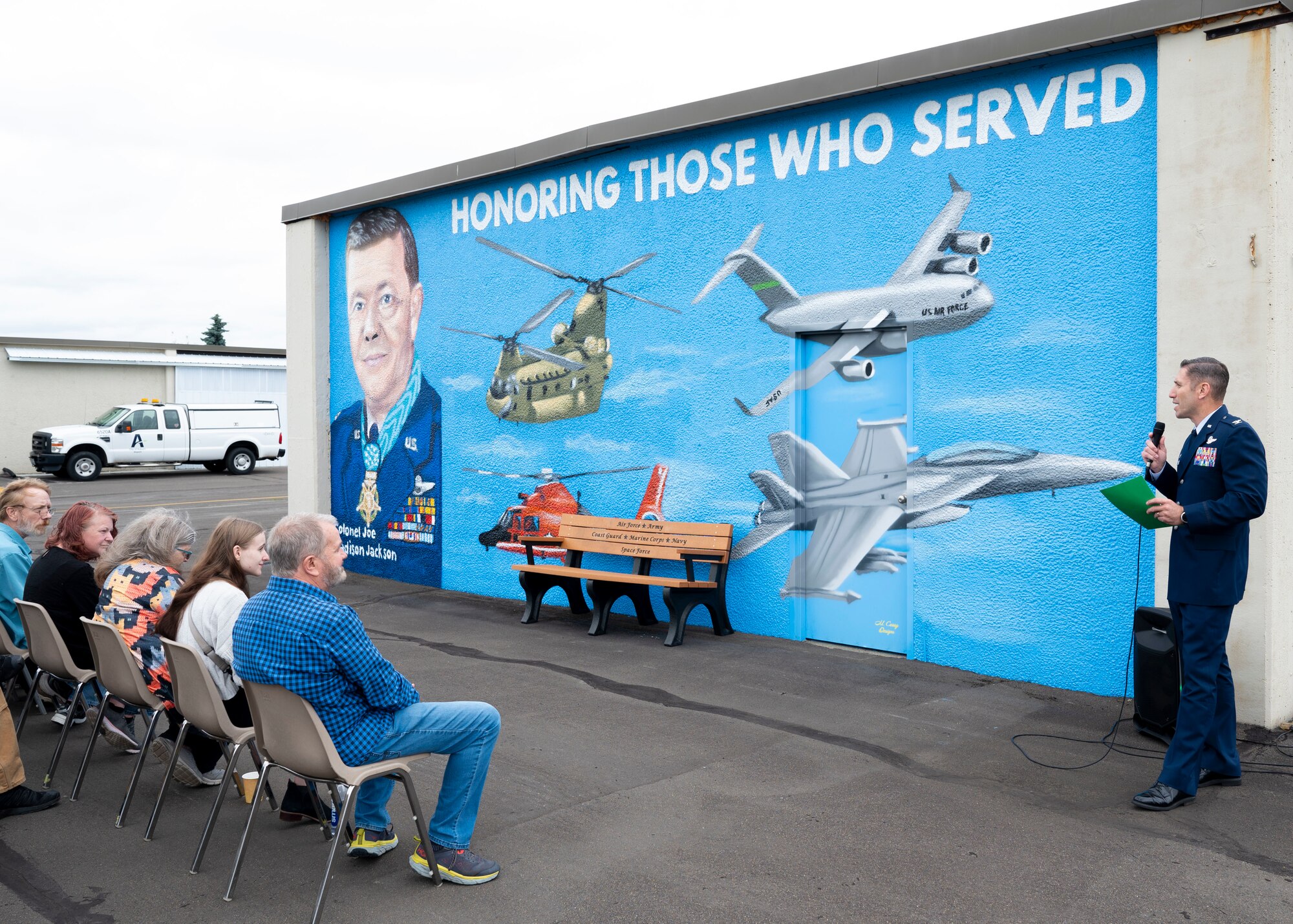 A dedication ceremony to unveil the new Col. Joe Jackson mural and bench was held at Auburn Municipal Airport, Washington, June 17, 2024. The ceremony honored Jackson, his family who were present at the event and those who have served. Jackson was awarded the Medal of Honor by President Lyndon B. Johnson for his efforts in saving three Airmen in an evacuation during the Vietnam War.
