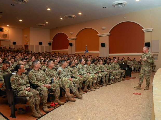 U.S. Air Force Chief Master Sgt. David Wolfe, command chief of Air Combat Command, briefs Airmen and Guardians during an all call at the Independence Theater on Beale Air Force Base, California, June 5, 2024.
