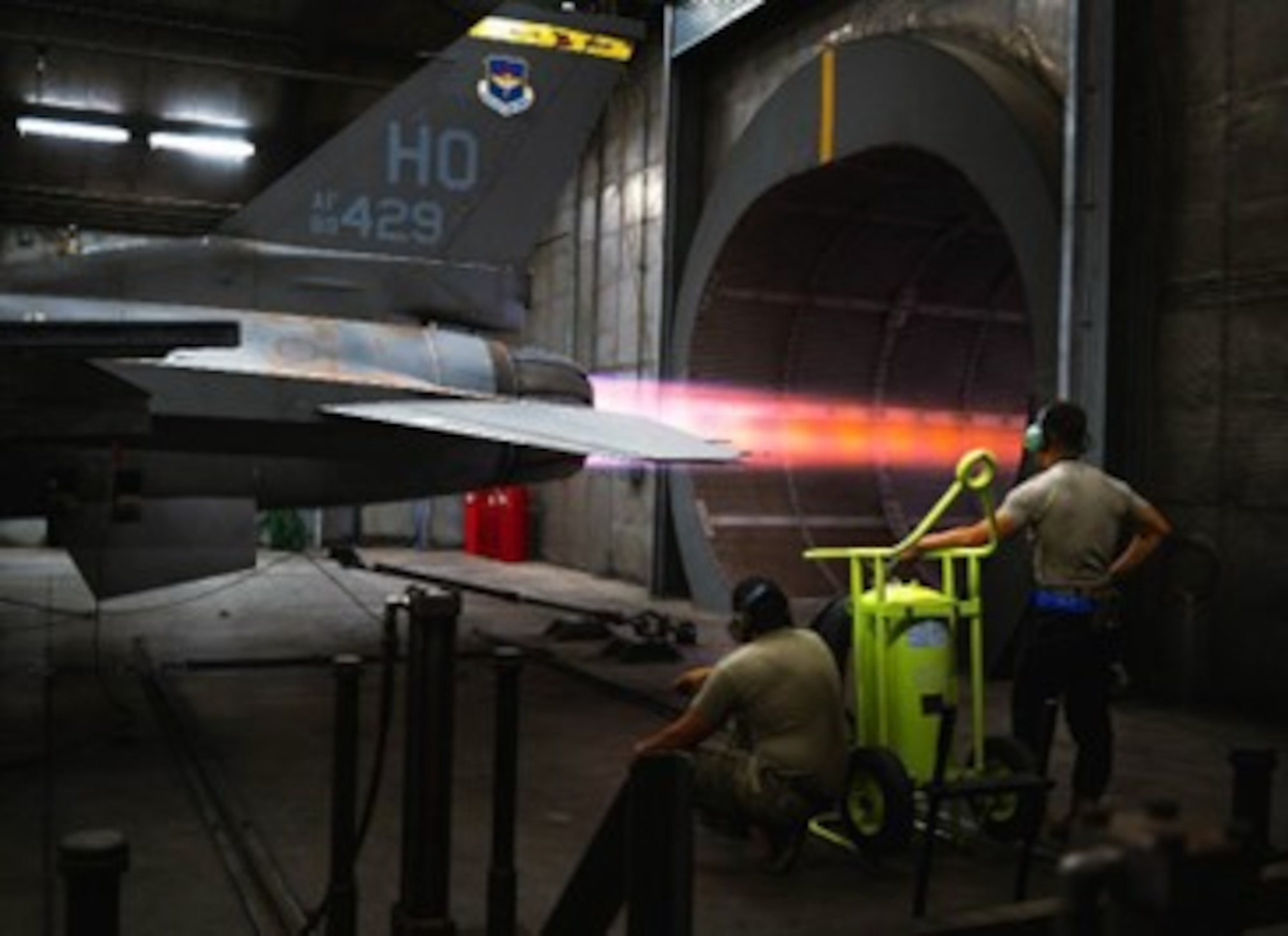 SrA. Jamir Rosales and Mr. Cameron Smith, 309th Fighter Squadron aerospace propulsion specialists, stand by as ground control during installed engine operation certification for a General Electric F110 powered Bock 40 at Luke AFB, AZ, Jul. 20, 2023. The GE F110 is an afterburning turbofan jet engine that powers the F-16 Fighting Falcon.