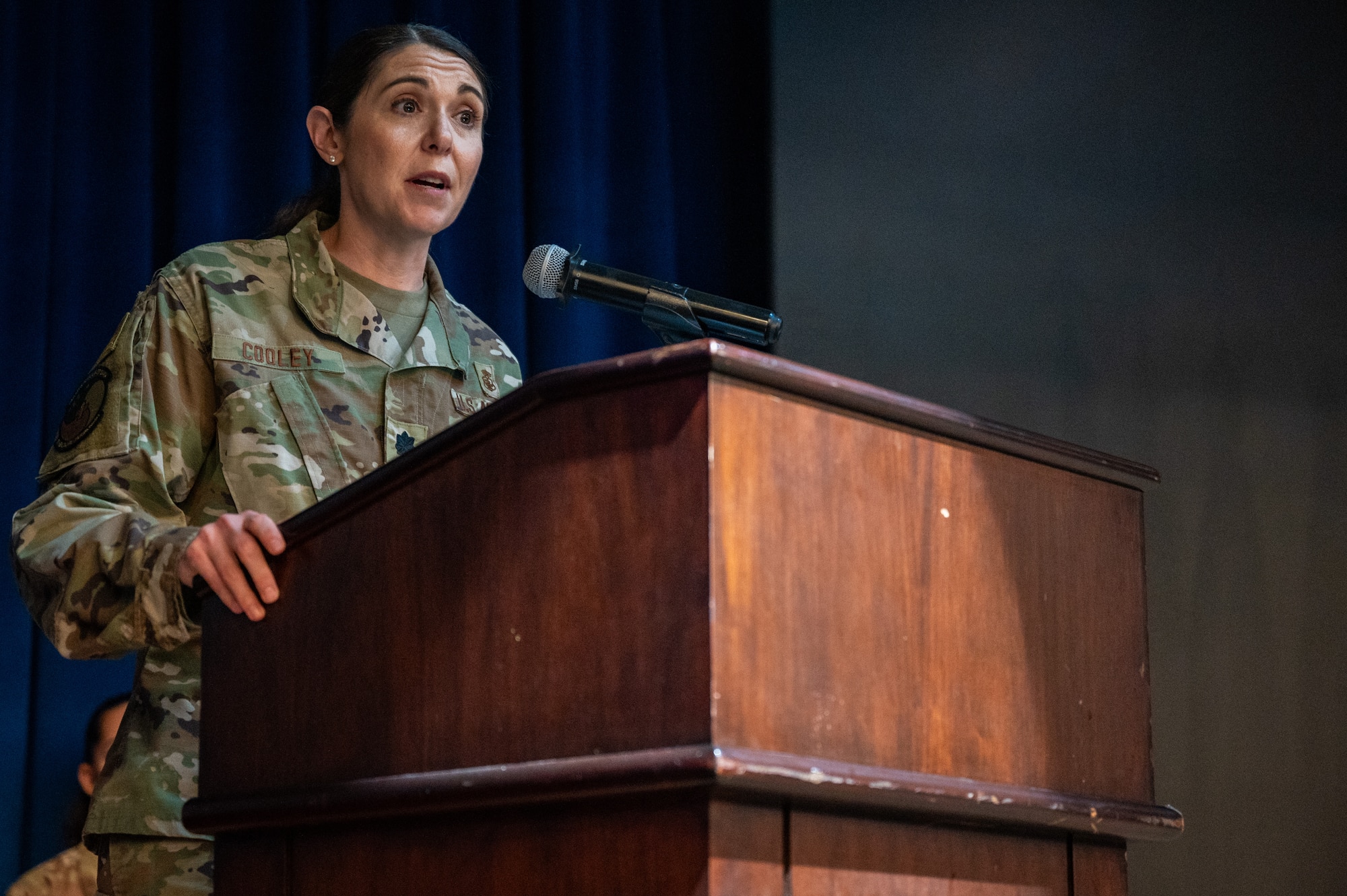 U.S. Air Force Lt. Col. Joanna Cooley, 51st Healthcare Operations Squadron commander, gives her first speech as squadron commander during a change of command ceremony at Osan Air Base, Republic of Korea, June 18, 2024. Cooley will play a direct role in ensuring that medical readiness for contingencies is maintained, by providing high-quality, trusted care for approximately 8,000 enrollees and over 20,000 beneficiaries. (U.S. Air Force photo by Airman 1st Class Chase Verzaal)