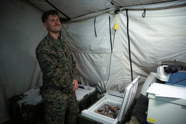 U.S. Navy Petty Officer 2nd Class Seth Robinson, a laboratory technician with Combat Logistics Battalion 13, Combat Logistics Regiment 17, 1st Marine Logistics Group, and a native of Hurst, Texas, verifies blood types to establish the first Role II medical field hospital on Palau during exercise Valiant Shield 24 at Camp Katuu, Palau, June 7, 2024. Valiant Shield enables real-world proficiency in sustaining joint forces through detecting, locating, tracking and engaging units at sea, in the air, on land and in cyberspace in response to a range of mission areas. I Marine Expeditionary Force consistently engages in exercises with allies and partners across the Indo-Pacific region to bolster regional security, maintain access and advance a free and open Indo-Pacific. (U.S. Marine Corps photo by Sgt. Nello Miele)