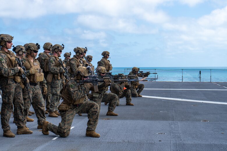 U.S. Marines with Weapons Company, 2nd Battalion, 5th Marine Regiment (Reinforced), Marine Rotational Force – Darwin 24.3, fire M4 carbines as part of a Combat Marksmanship Program live-fire deck shoot aboard the HMAS Adelaide (L01) during the Wet and Dry Exercise Rehearsal, in the Arafura Sea, June 5, 2024. Marines and Sailors embarked on HMAS Adelaide (L01) alongside their Australian Allies to participate in WADER, transiting from Darwin to Townsville from June 2-20, 2024. During WADER, elements from the MRF-D Marine Air-Ground Task Force will conduct MV-22B Osprey deck landing qualifications, a live-fire deck shoot, medical subject matter expert exchanges, enhance amphibious fires, command and control, and initiate a ship-to-shore movement in order to set conditions for future operational tasking. (U.S. Marine Corps photo by Gunnery Sgt. Kassie McDole)