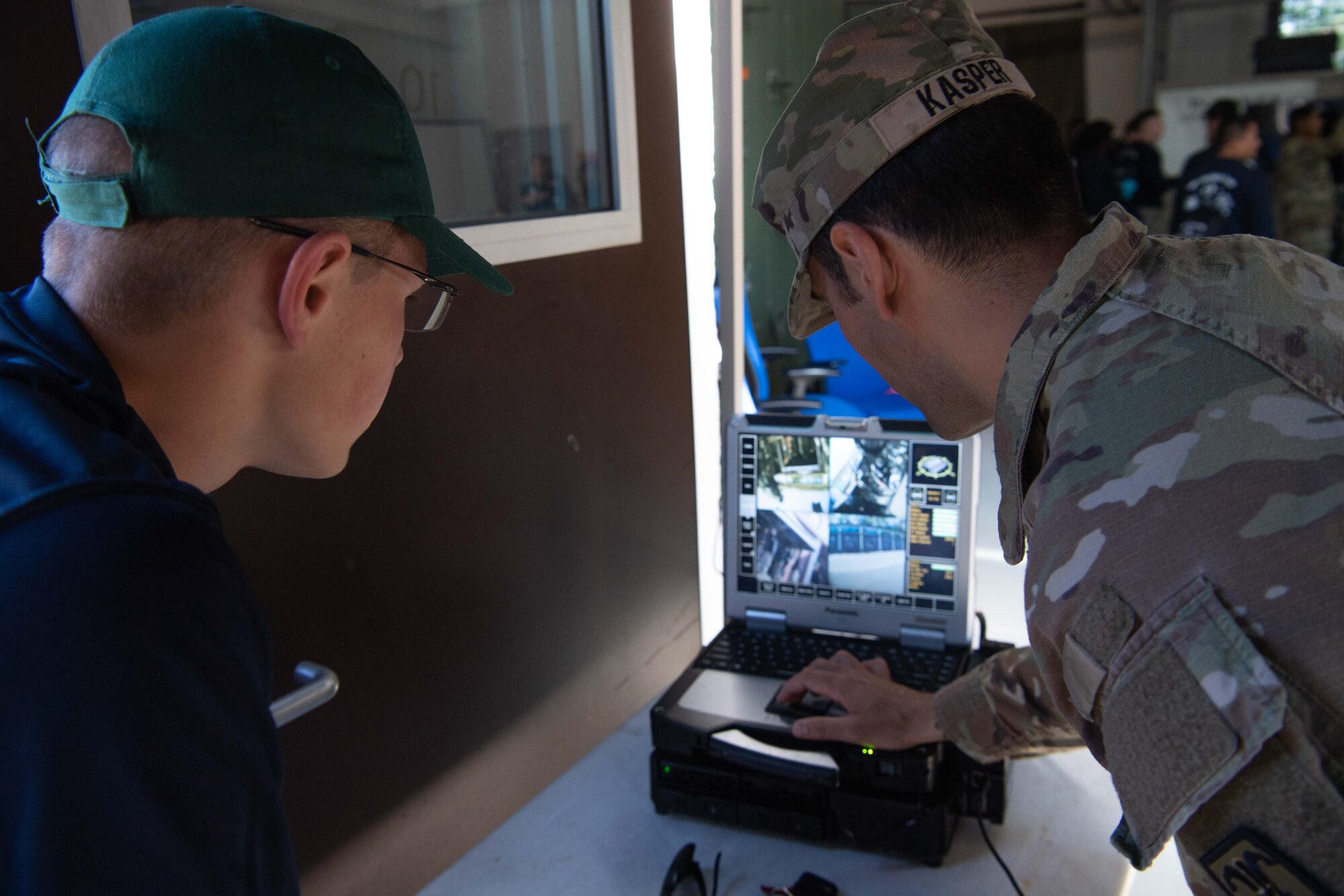 A man points at a screen