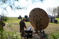 U.S. Air Force Tech. Sgt. Issac Adducchio, assigned to the 269th Combat Communications Squadron, contacts the Defense Information Systems Agency to establish satellite communications at Alpena Combat Readiness Training Center, Michigan, May 14, 2024, as part of their larger annual training exercise. This annual training guarantees the readiness and deployability of equipment and Airmen.