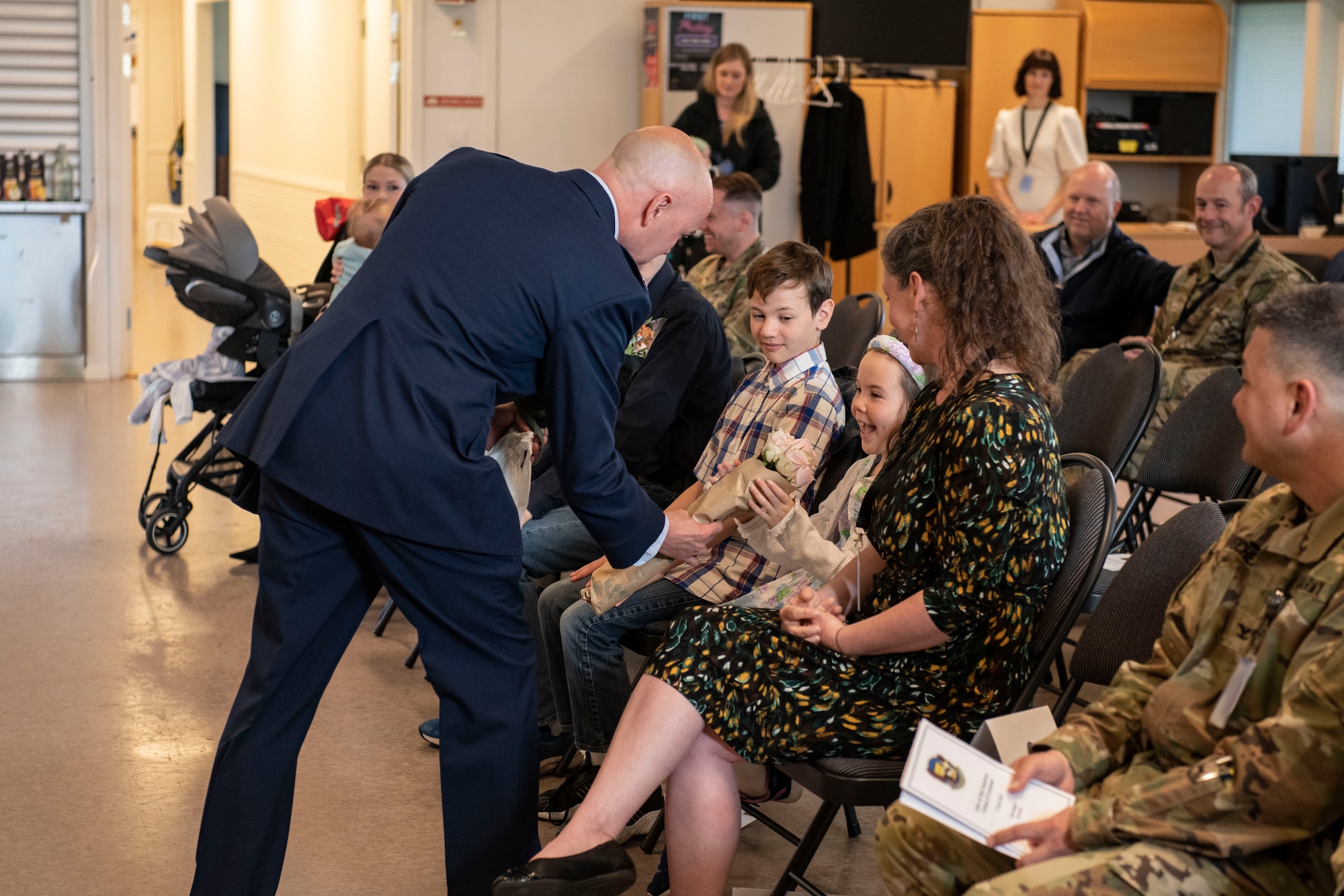 Lt. Col. Joseph H. Manning, 426th Air Base Squadron outgoing commander, gives flowers to his daughter during the 426th ABS change of command ceremony on Jåttå Military Compound, Norway