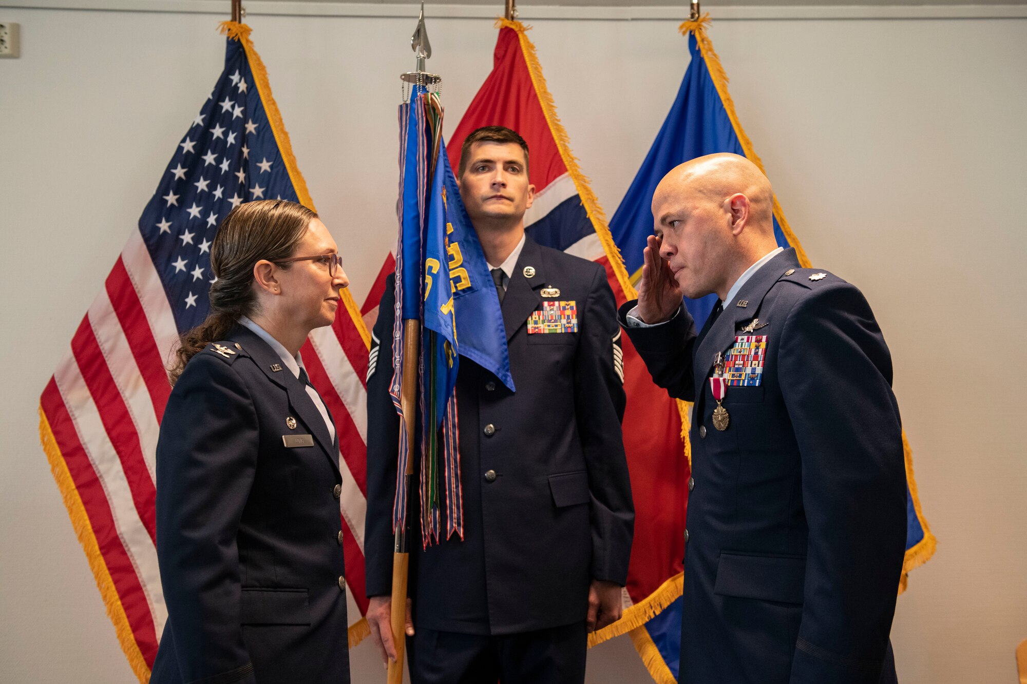 Lt. Col. Joseph H. Manning, 426th Air Base Squadron outgoing commander, right, relinquishes command to Col. Valarie A. Long, 423d Air Base Group commander, during the 426th ABS change of command ceremony on Jåttå Military Compound, Norway
