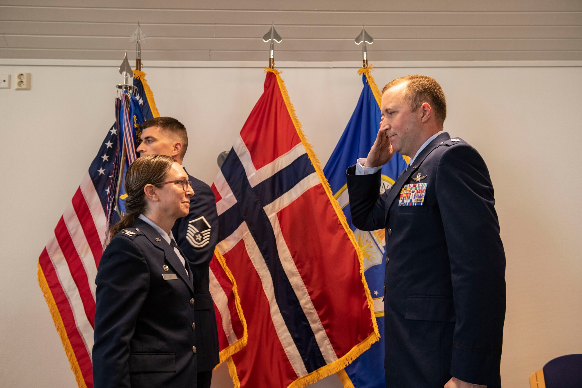 Lt. Col. Daniel A. Hayes, 426th Air Base Squadron incoming commander, right, accepts command from Col. Valarie A. Long, 423d Air Base Group commander, during the 426th ABS change of command ceremony on Jåttå Military Compound, Norway