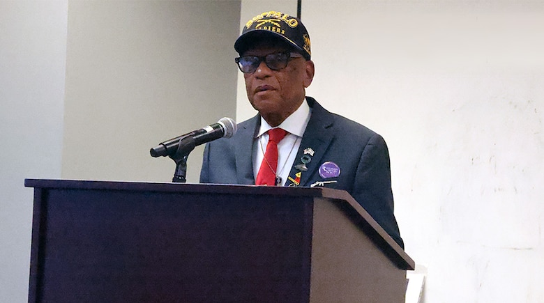 Man speaking at a podium