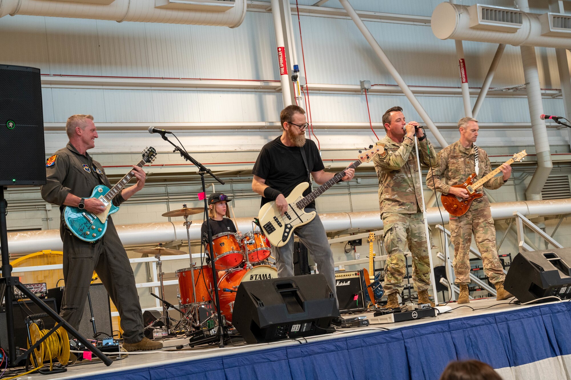 U.S. Air Force Brig. Gen. Jason Rueschhoff, 56th Fighter Wing commander, and members of the Fighter Country Talent Squad perform during an honorary commander farewell event, June 14, 2024, at Luke Air Force Base, Arizona.