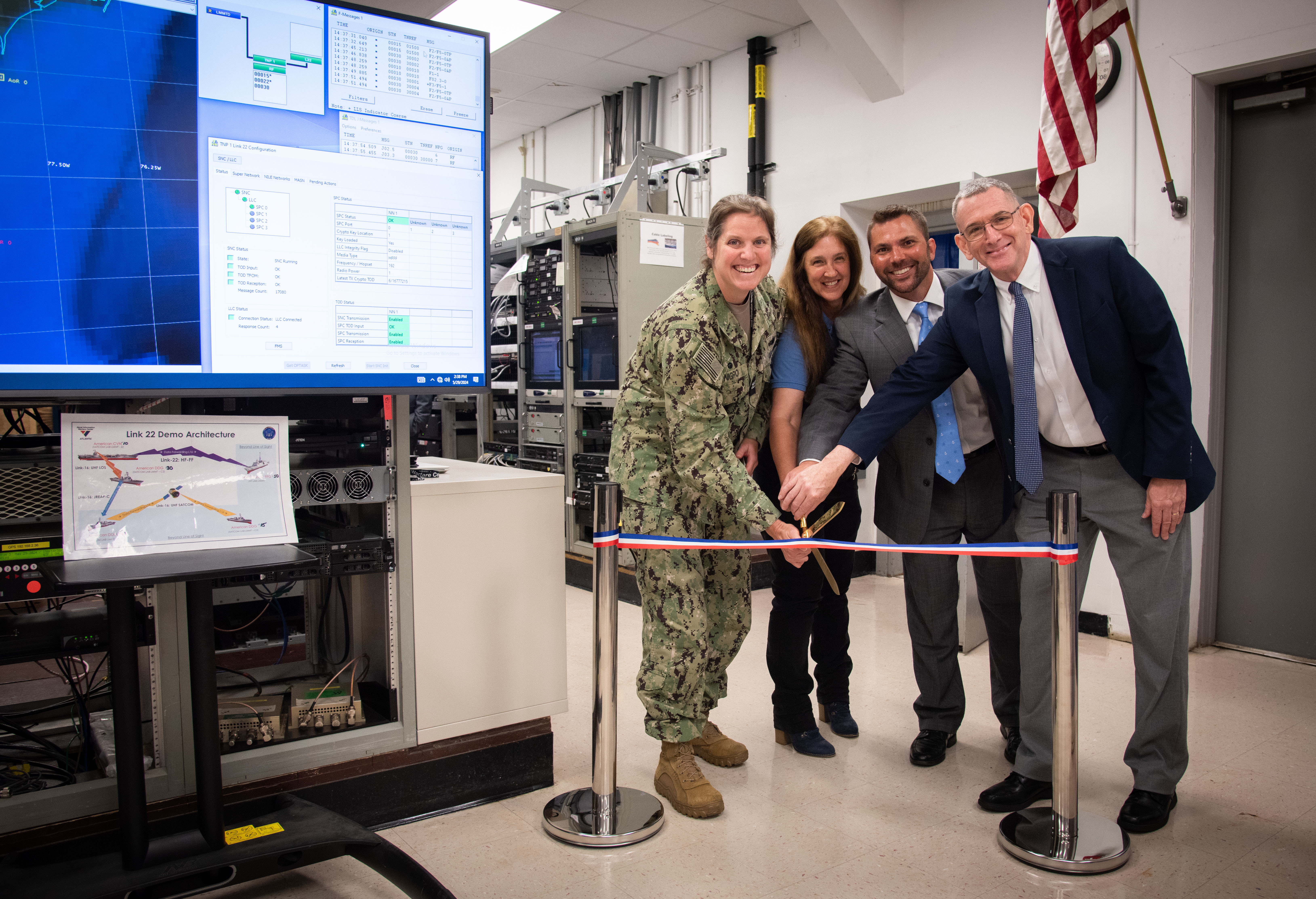 Left to right, Captain Nicole Nigro, commanding officer, Naval Information Warfare Center (NIWC) Atlantic, Ms. Betty Knott, project lead, Mr. John Meade, integrated product team lead and Mr. Peter Reddy, NIWC Atlantic Executive Director cut the ribbon at the opening of the Link 22 Lab. This new lab gives NIWC Atlantic the advantage of being able to air test live and to provide the warfighter with the necessary tools to communicate worldwide.