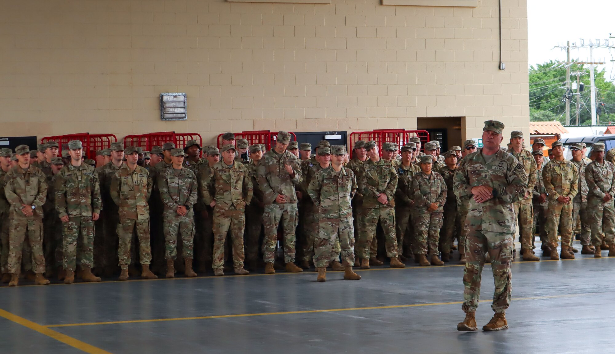 A photo of a Soldier talking to a crowd.