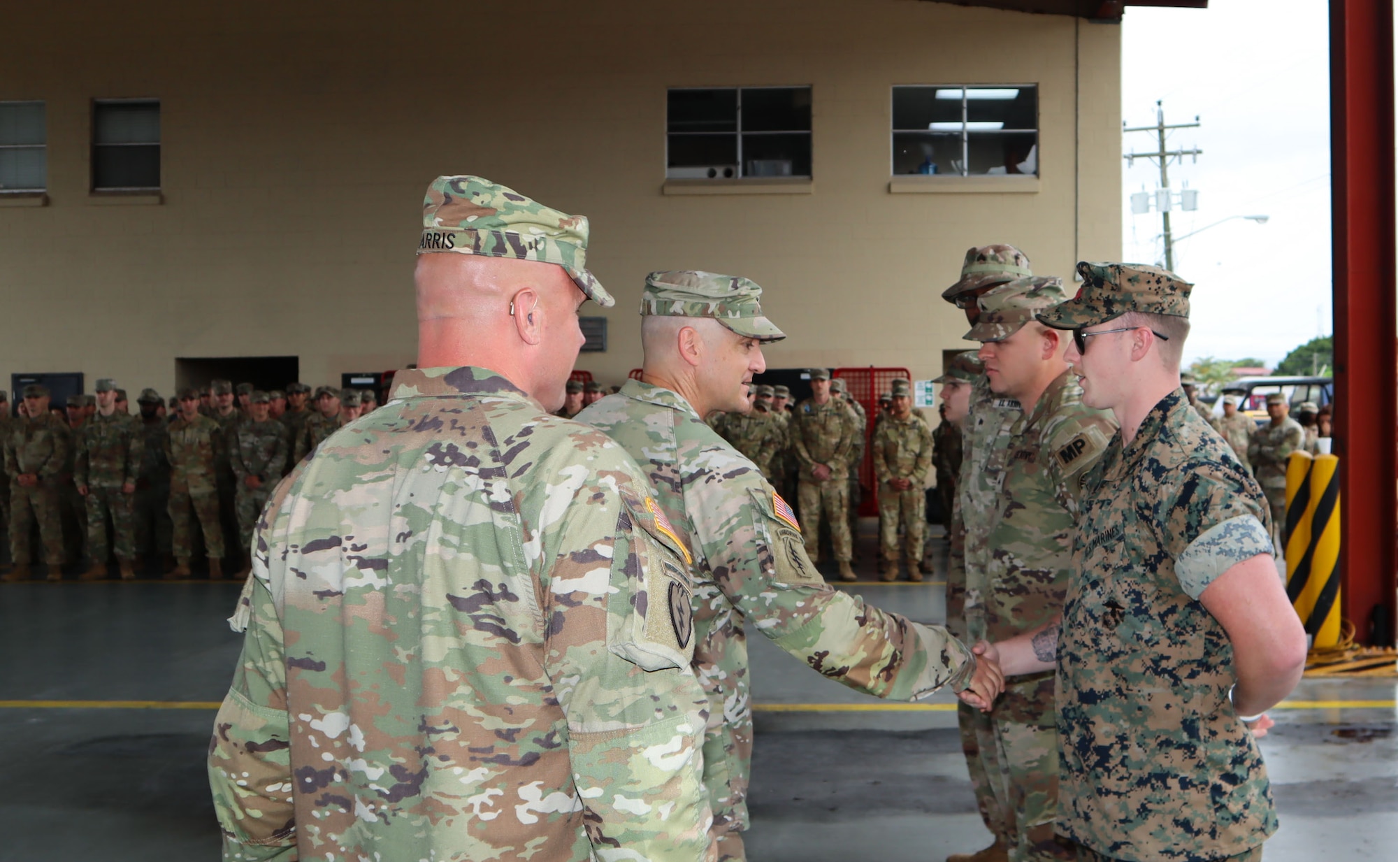 A photo of service member getting coined.