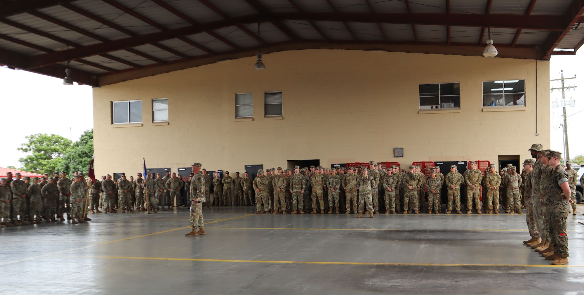 A photo of a Soldier talking to a crowd.