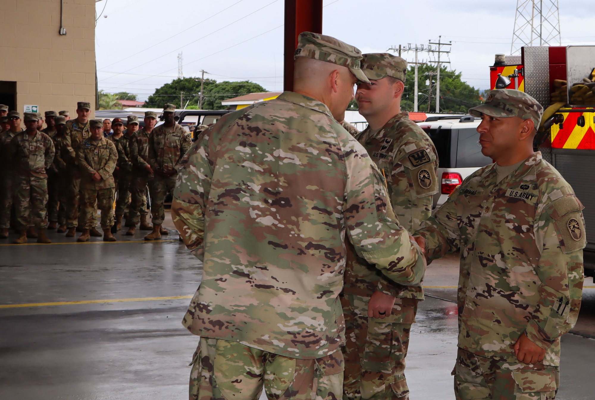 A photo of Soldiers getting coins.