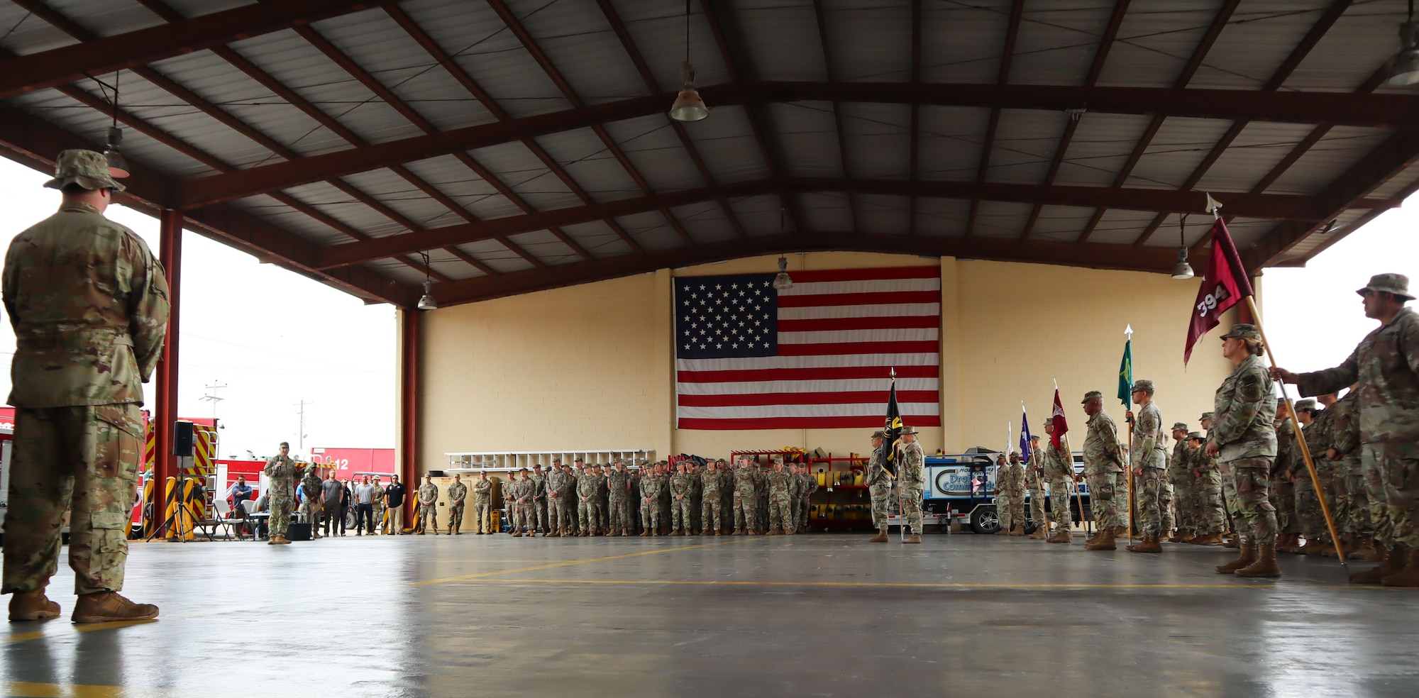 A photo of a Soldier talking to a crowd.