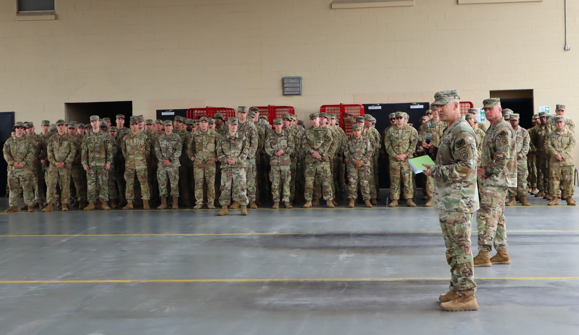 A photo of a Soldier talking to an audience.