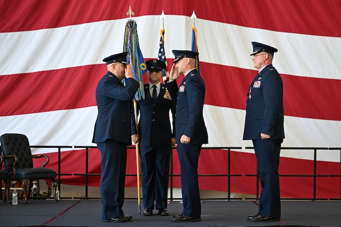 Col. Chad Overton, incoming 314th Operations Group commander, salutes Col. Jonathan Tucker, 314th Airlift Wing commander, during a change of command ceremony at Little Rock Air Force Base, Arkansas, June 13, 2024. The ceremony welcomed incoming commander Col. Chad Overton and bid farewell to Col. Joseph Bonner.