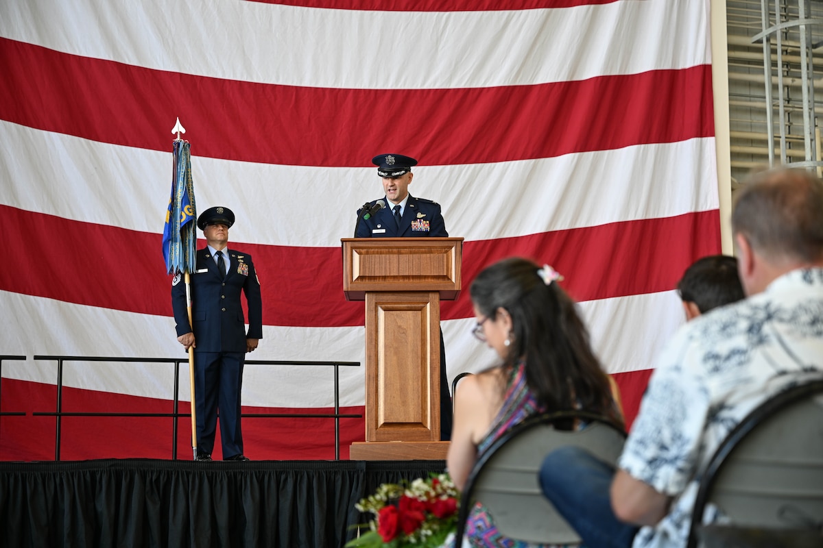 Col. Chad Overton, incoming 314th Operations Group commander, speaks at a podium during a change of command ceremony at Little Rock Air Force Base, Arkansas, June 13, 2024. The ceremony welcomed incoming commander Col. Chad Overton and bid farewell to Col. Joseph Bonner.