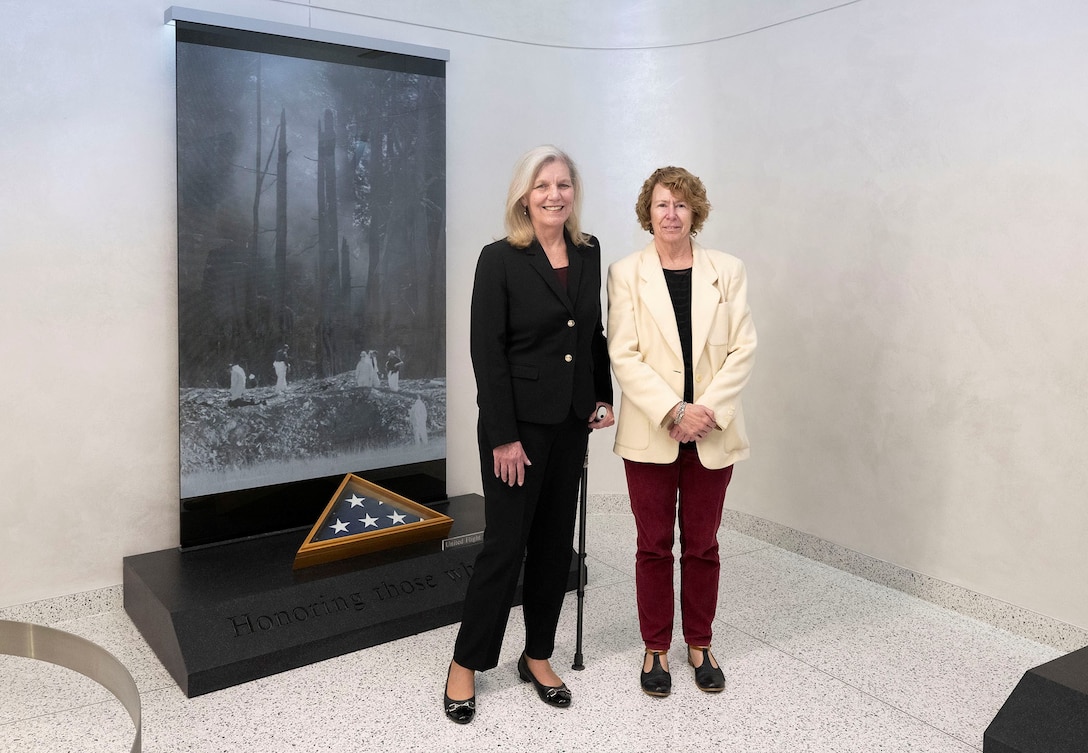 NSA Deputy Director Wendy Noble with Debby Borza, mother of 9/11 victim, standing in front of the 9/11 memorial at NSA/CSS Washington’s East Campus.