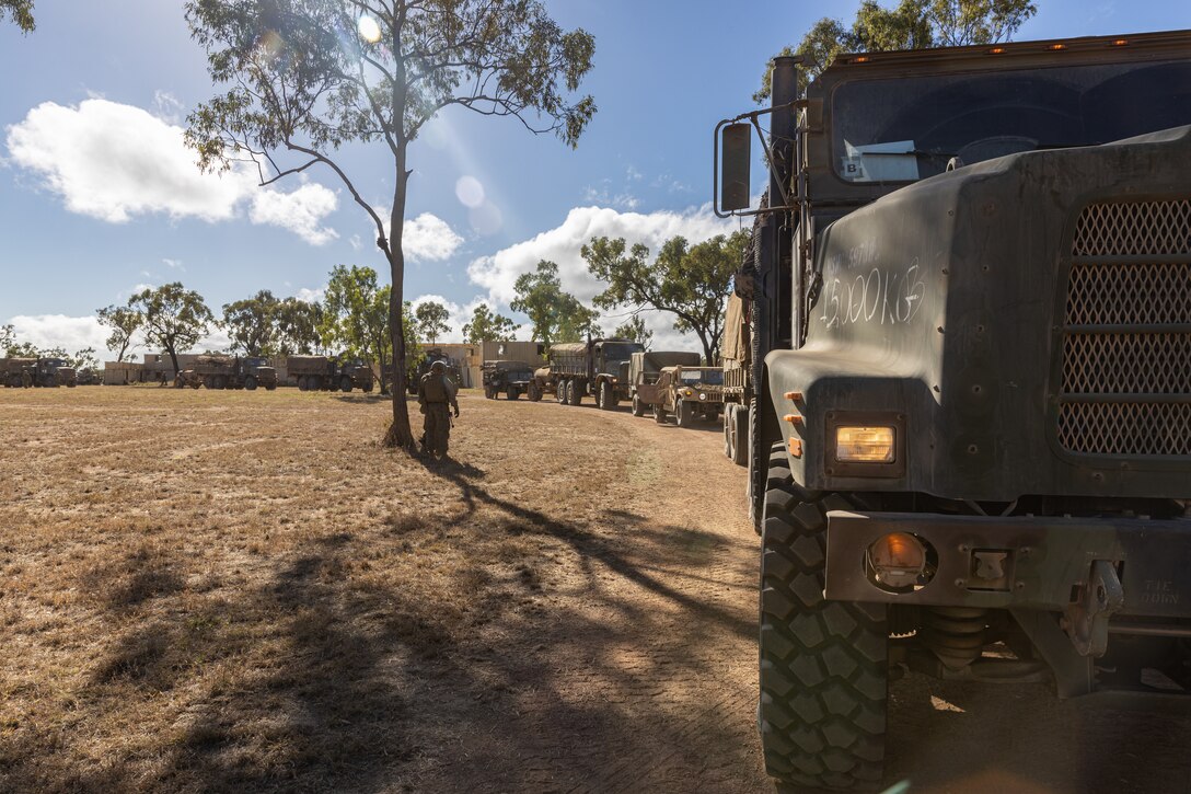 U.S. Marines with Combat Logistics Battalion 5 (Reinforced), Marine Rotational Force – Darwin 24.3, stage tactical vehicles during Exercise Southern Jackaroo at Townsville Field Training Area, Queensland, Australia, May 26, 2024. Members of MRF-D 24.3 deployed to Townsville Field Training Area, QLD, Australia to participate in Exercise Southern Jackaroo 24, a multilateral combined arms exercise held with capabilities and personnel from the Australian Army, U.S. Army and Marine Corps, Papua New Guinea Defence Force, and the Japanese Ground Self-Defense Force to increase interoperability with Allies and partners. (U.S. Marine Corps photo by Cpl. Manuel Rivera)