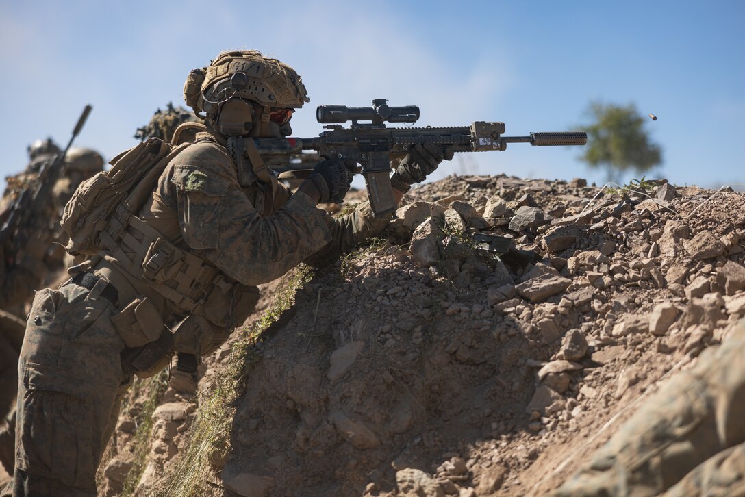 U.S. Marine Corps Lance Cpl. Elijah Brown, a rifleman with Golf Company, 2nd Battalion, 5th Marine Regiment (Reinforced), Marine Rotational Force – Darwin 24.3, fires an M27 infantry automatic rifle while participating in a live-fire defense during Exercise Southern Jackaroo 24 at Townsville Field Training Area, Queensland, Australia, June 8, 2024. Members of MRF-D 24.3 deployed to TFTA to participate in Exercise Southern Jackaroo 24, a multilateral combined arms exercise held with capabilities and personnel from the Australian Army, U.S. Army and Marine Corps, Papua New Guinea Defence Force, and the Japanese Ground Self-Defense Force to increase interoperability with Allies and partners. Brown is a native of California. (U.S. Marine Corps photo by Cpl. Earik Barton)
