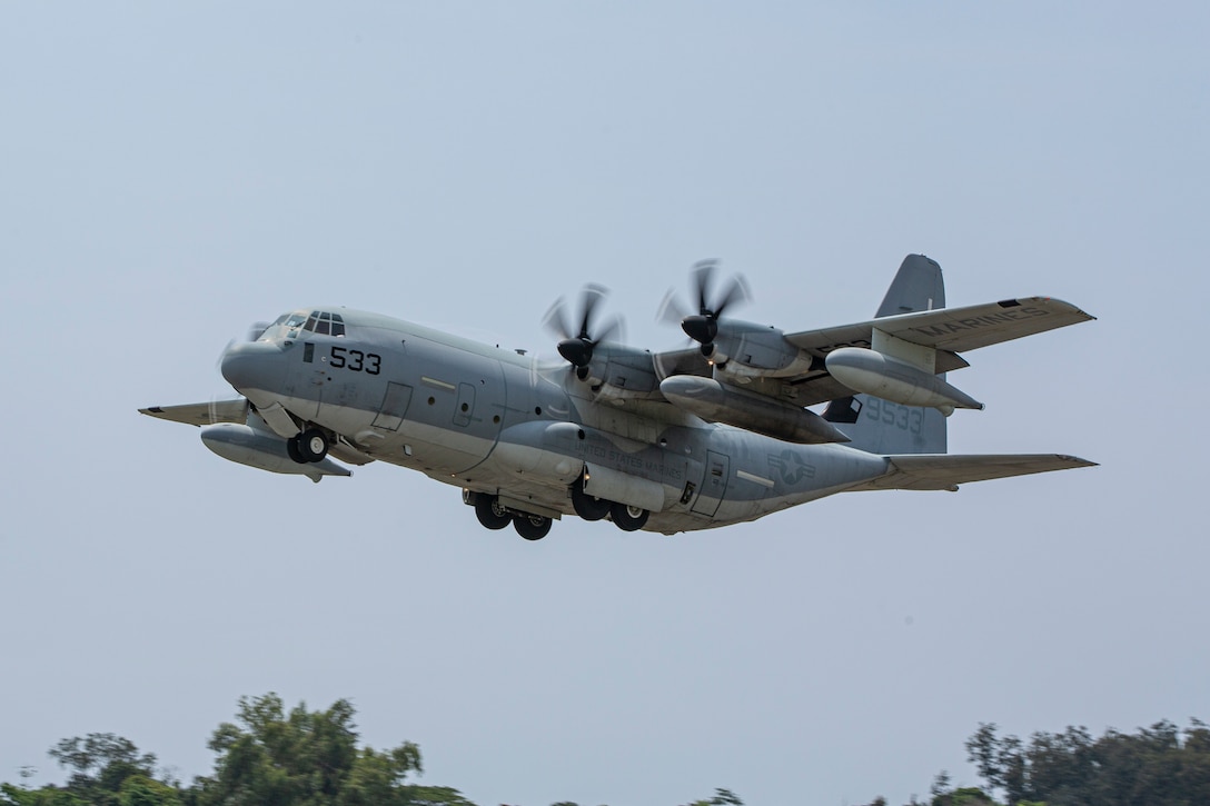 A U.S. Marine Corps KC-130J Super Hercules with Marine Aerial Refueler Transport (VMGR) 352, Marine Aircraft Group 11, 3rd Marine Aircraft Wing, takes off after refueling at a forward arming and refueling point at Laoag International Airport, Laoag, Philippines, June 15, 2024. The FARP supported aircraft with Marine Aerial Refueler Transport (VMGR) 352, Marine Aircraft Group 11, 3rd MAW, and 1st Special Operations Squadron during Marine Aviation Support Activity 24. MASA is an annual Philippine-U.S. military exercise focused on mutual defense, strengthening relationships, and rehearsing emerging aviation concepts. (U.S. Marine Corps photo by Cpl. Nikolas Mascroft)