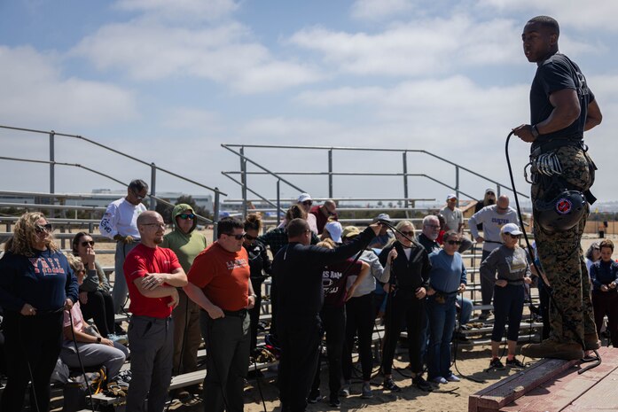 U.S. Marine Corps Staff Sgt. Aryan Snow-Jackson, a helicopter rope suspension technique master with Support Battalion, Instructor Training Company, briefs educators from Recruiting Stations Denver, Fort Worth, Houston, and Salt Lake City on safety techniques as a part of the 2024 Educators Workshop at Marine Corps Recruit Depot, San Diego, May 30, 2024. Participants of the workshop visited MCRD San Diego to observe recruit training and gain a better understanding about the transformation from recruits to United States Marines. Educators also received classes and briefs on the benefits that are provided to service members in the United States armed forces. (U.S. Marine Corps photo by Lance Cpl. Eric Valerio)