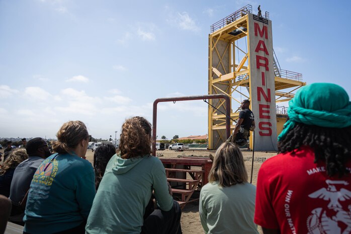 U.S. Marine Corps Staff Sgt. Aryan Snow-Jackson, a helicopter rope suspension technique master with Support Battalion, Instructor Training Company, briefs educators from Recruiting Stations Denver, Fort Worth, Houston, and Salt Lake City on safety techniques as a part of the 2024 Educators Workshop at Marine Corps Recruit Depot, San Diego, May 30, 2024. Participants of the workshop visited MCRD San Diego to observe recruit training and gain a better understanding about the transformation from recruits to United States Marines. Educators also received classes and briefs on the benefits that are provided to service members in the United States armed forces. (U.S. Marine Corps photo by Lance Cpl. Eric Valerio)