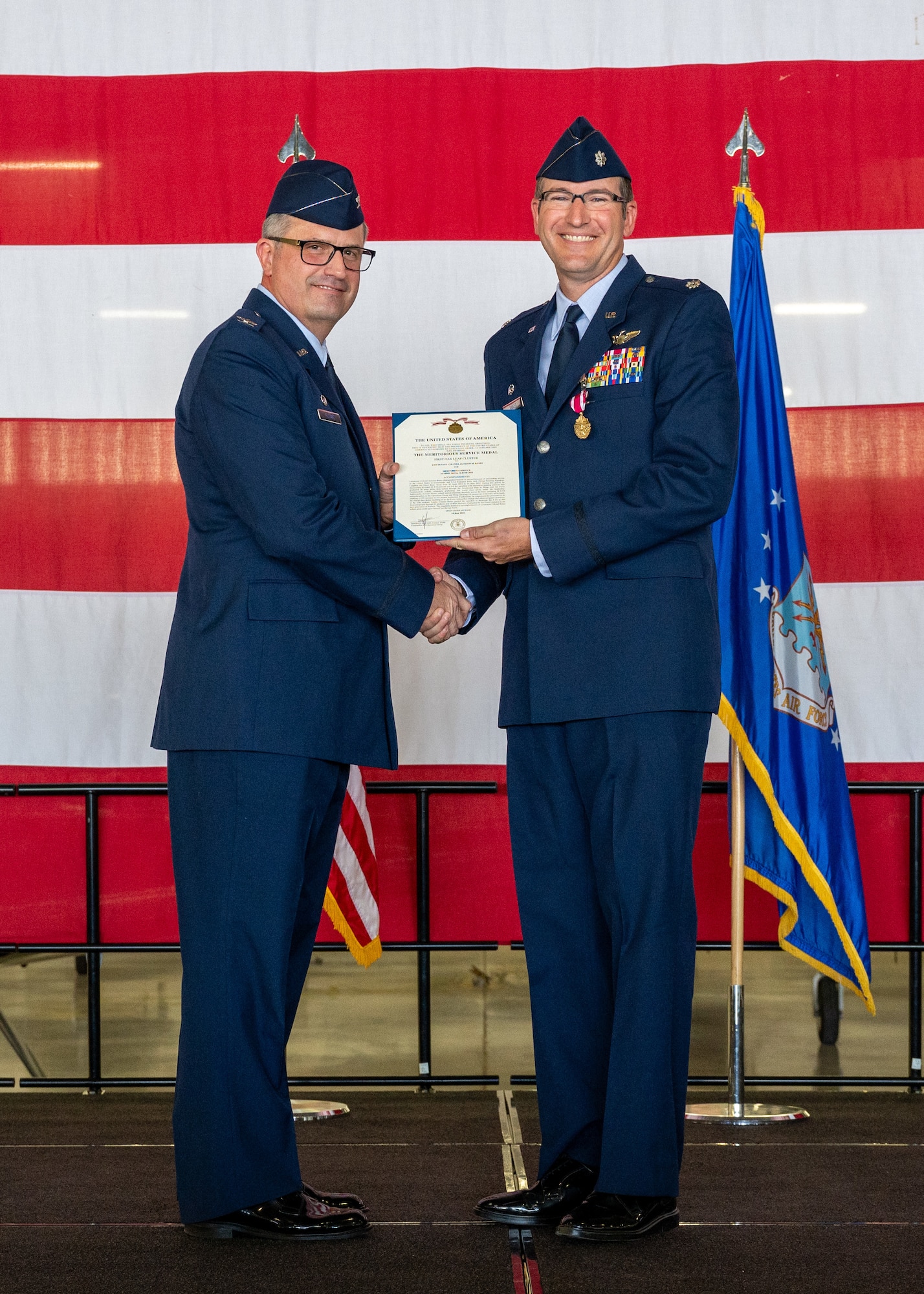 U.S. Air Force Col. Joseph McCane, 47th Operations Group commander, presents the Meritorious Service Medal to Lt. Col. Jackson Ranes, 86th Flying Training Squadron (FTS) commander, during the 86th FTS change of command ceremony at Laughlin Air Force Base, Texas, June 14, 2024. The Meritorious Service Medal was established as the counterpart of the Bronze Star Medal for the recognition of meritorious noncombatant service. (U.S. Air Force photo by Staff Sgt. Nicholas Larsen)